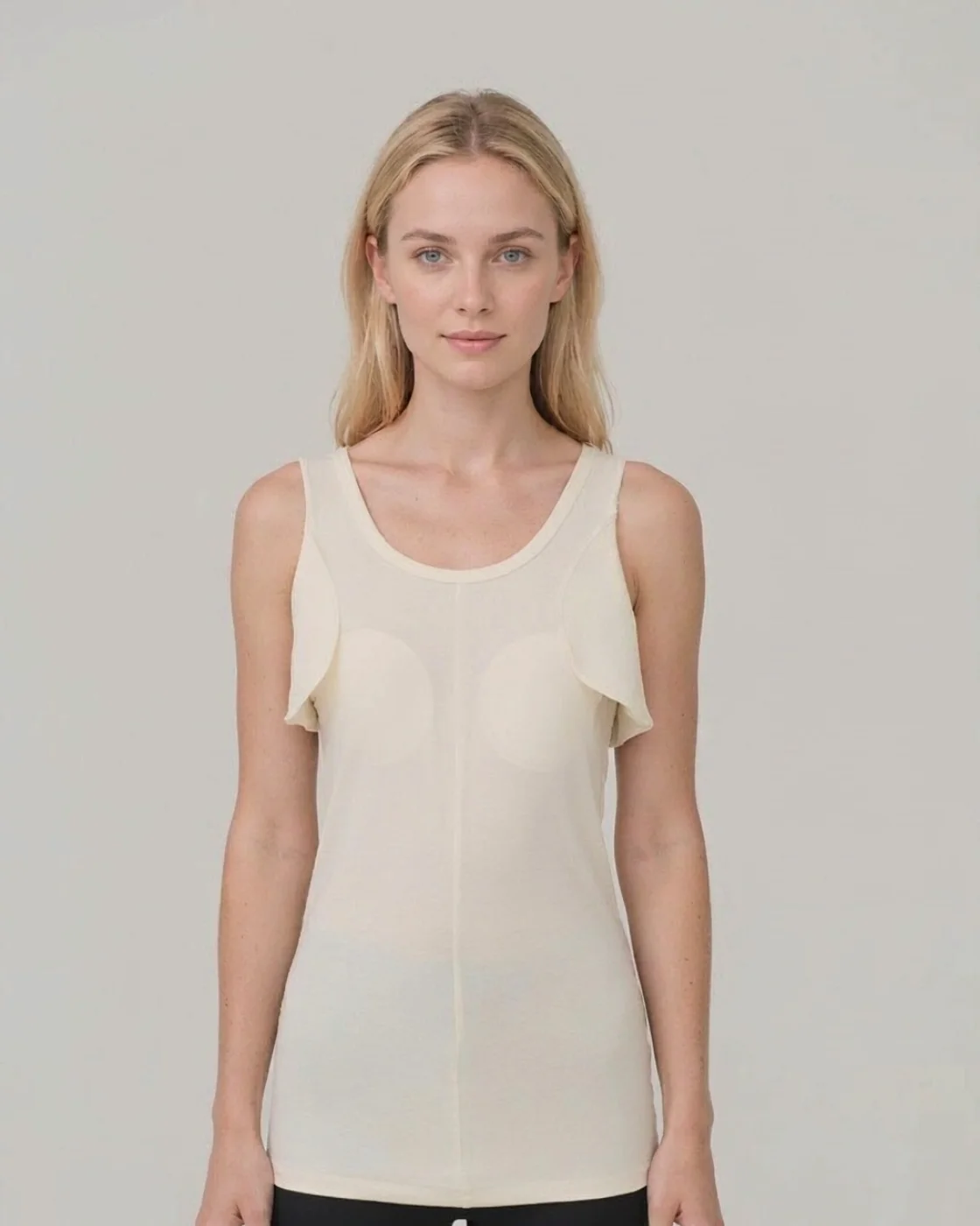SS-01 knit liner with axilla flaps, ivory, worn by a woman, front view